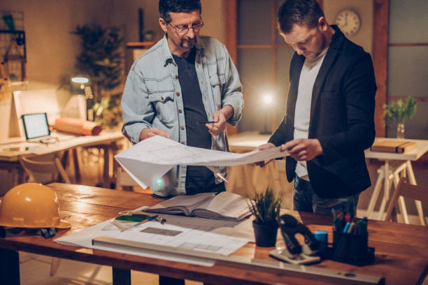 Expert lighting consultant reviewing floor plan for custom lighting design project